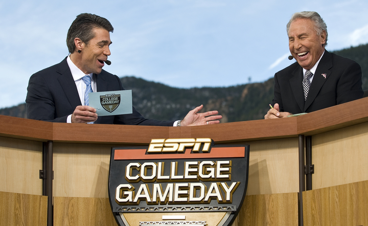 Chris Fowler, left, and Lee Corso, right, two of ESPN's "College GameDay" broadcasters joke during a live broadcast from the U.S. Air Force Academy Nov. 7 before the Air Force vs. Army football game. The latest Academy visit is part of ESPN's salute to veterans of the U.S. armed forces, which will include a week of programming -- "America's Heroes: A Salute to Our Veterans" -- culminating in special "SportsCenter" editions from West Point on Veterans Day, Nov. 11. This is "College GameDay's" third visit to the Academy. (U.S. Air Force photo by/Staff Sgt. Bennie J. Davis III)