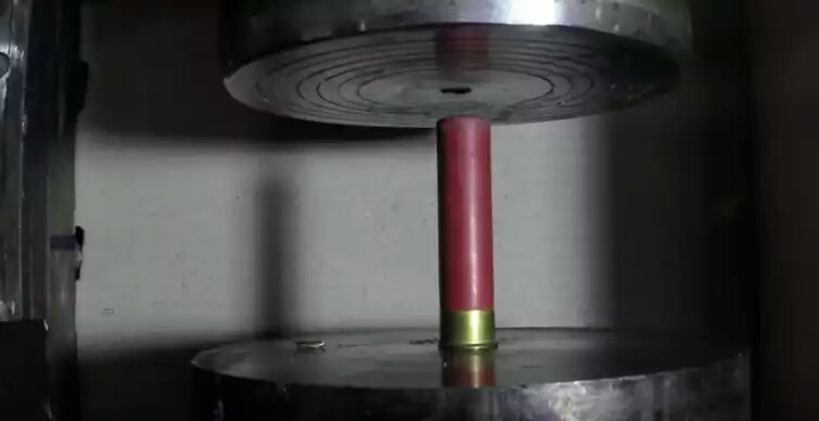 Watch what happens when a hydraulic press pulverizes live ammo Featured