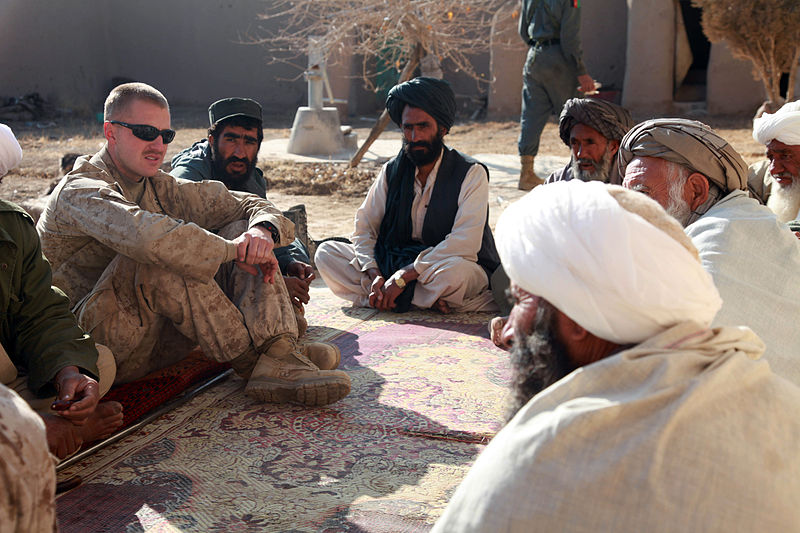 Major Jason Brezler in 2009 while he was a Corps Caption, speaking with Afghan leaders. 