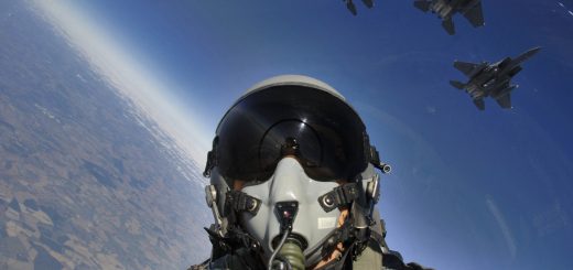 060803-F-2907C-107

	U.S. Air Force Master Sgt. Lance Cheung photographs himself and a three-ship formation of F-15E Strike Eagle aircraft from Royal Air Force Lakenheath, England, on Aug. 3, 2006.  The Strike Eagles are attached to the 492nd Fighter Squadron and are practicing basic surface attack techniques.  Cheung is a photojournalist for the Air Force News Agency in San Antonio, Texas.  DoD photo by Master Sgt. Lance Cheung, U.S. Air Force.  (Released)