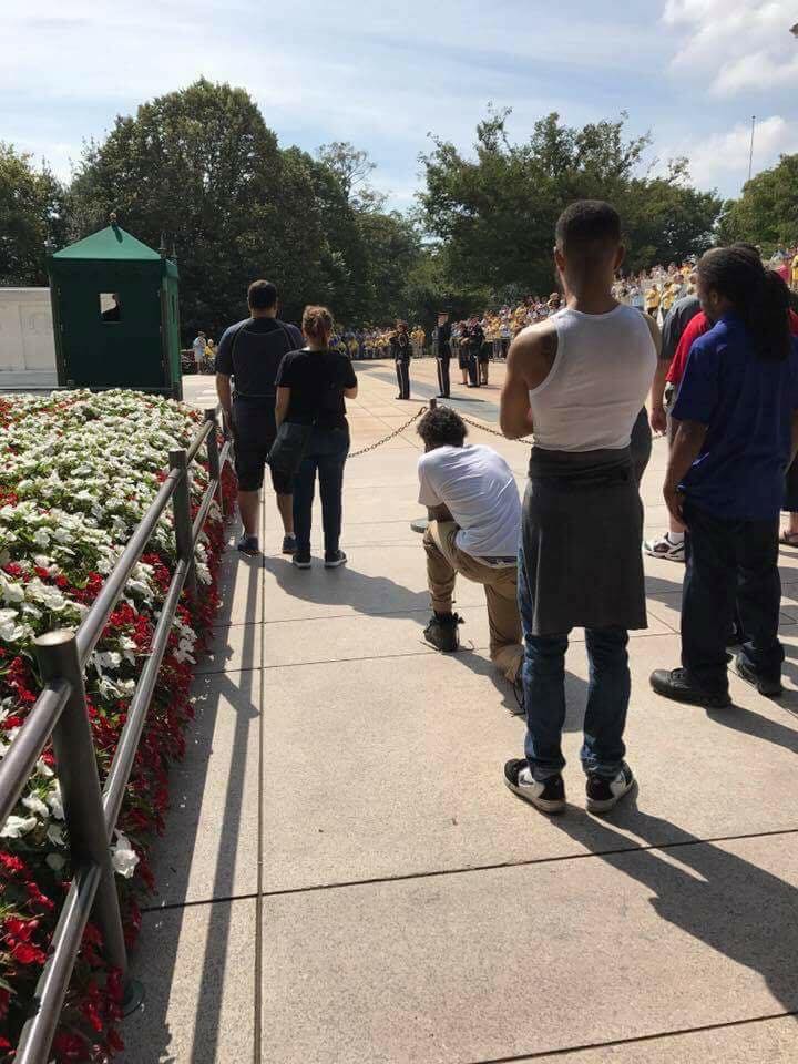 Kneeling at Tomb - Picture of man kneeling during taps at Tomb of the Unknown Soldier is sparking outrage following NFL protests