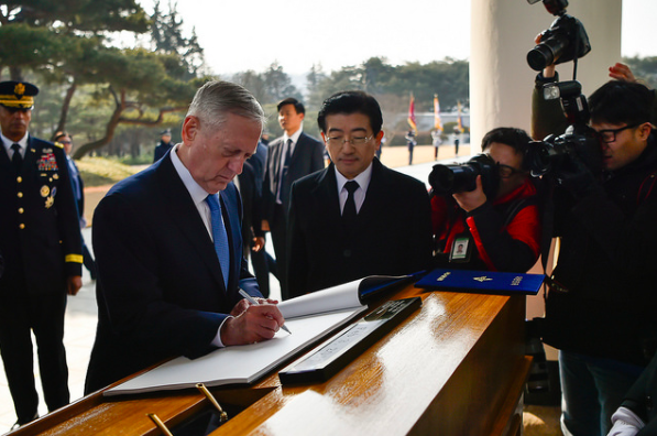 The U.S. SECDEF signs the guestbook during the wreath laying ceremony with the Republic of Korea's Minister of National Defense, the Honorable Han Min-goo.