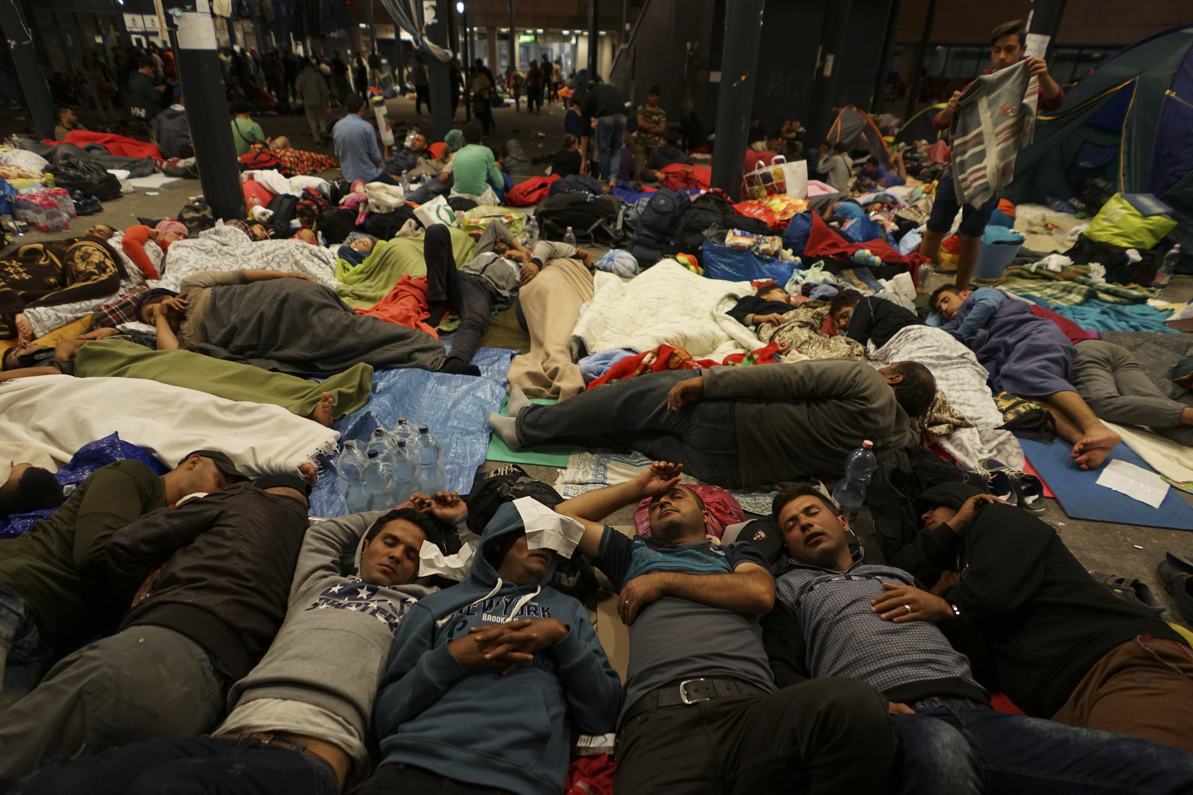 Syrian refugees having rest at the floor of Keleti railway station. Refugee crisis. Budapest, Hungary, Central Europe, 5 September 2015.