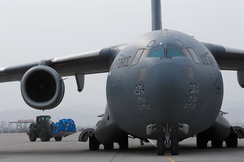 Nat'l Guard loaded C-17 with relief supplies for Harris photo op