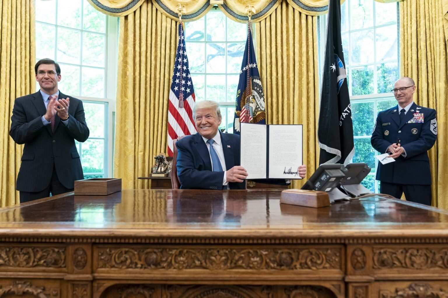Trump announces 'superduper missile' during Space Force flag reveal