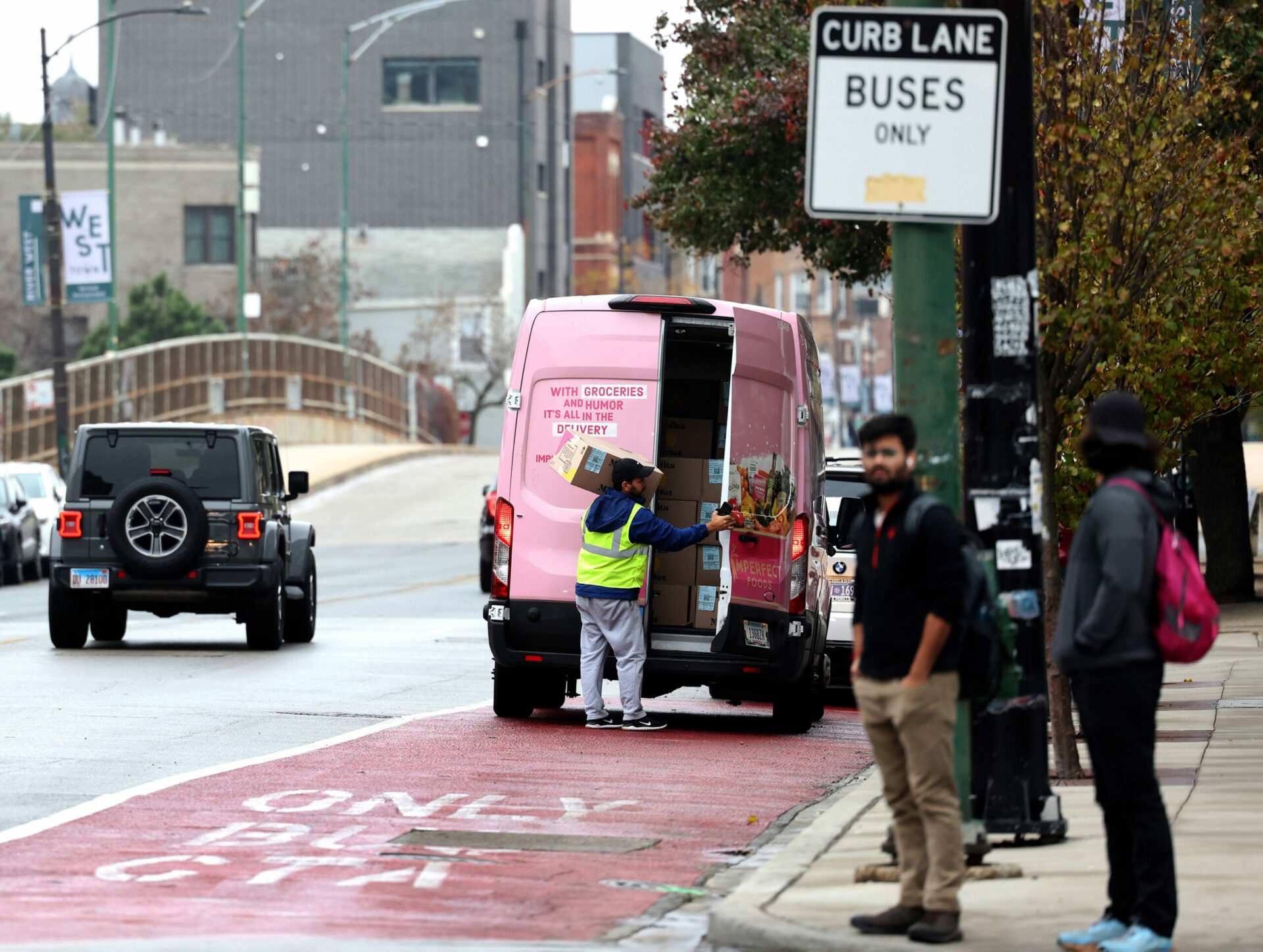 After delays, Chicago begins automated ticketing of drivers parked in bike, bus lanes