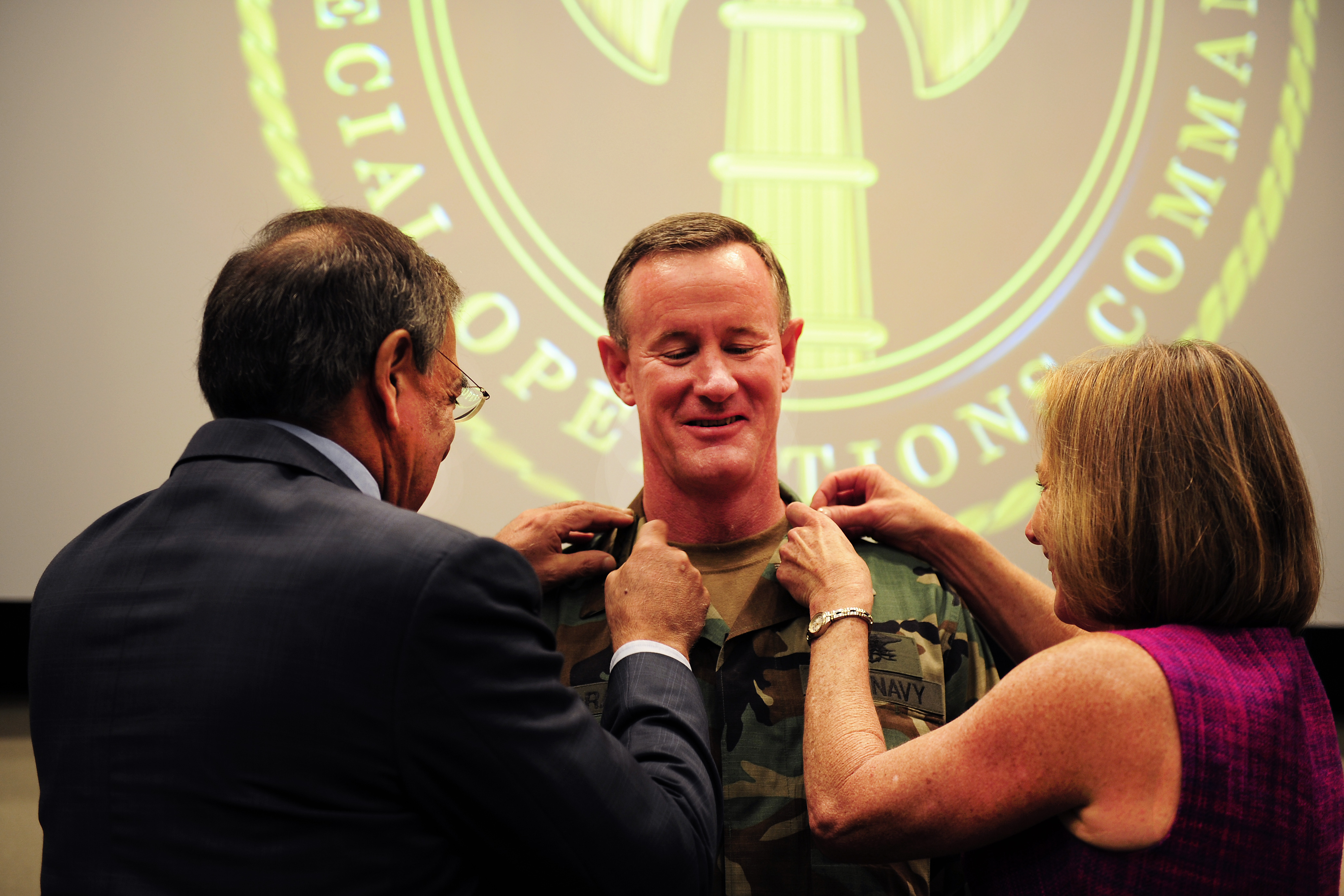 Secretary of Defense Leon E. Panetta affixes Adm. William H. McRaven's new rank as a four star admiral along with McRaven's wife at a U.S. Special Operations Command ceremony at MacDill Air Force Base, Fla., Aug. 8, 2011. 