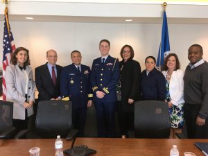 (From left to right) Brianne Alvis, Gary Rasicot, Rear Adm. Michael Johnston, Lt. Alex Rulon, Nicole Carter, SK3 Sasha Rodriguez, Kathy Scott, and Jaurin Joseph pose for a photo at a “How Inspiring Leaders Build a Culture of Engagement” event.