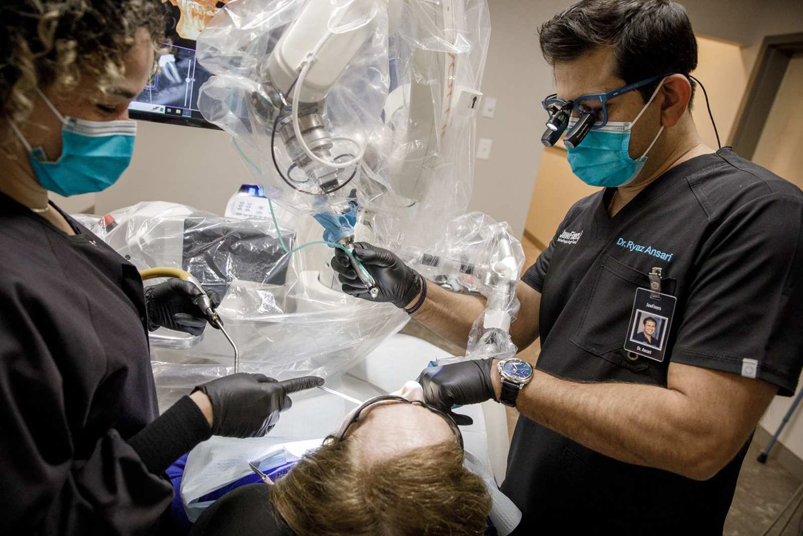 Pics: Oral surgeon has help when drilling implants. Meet his robotic ...