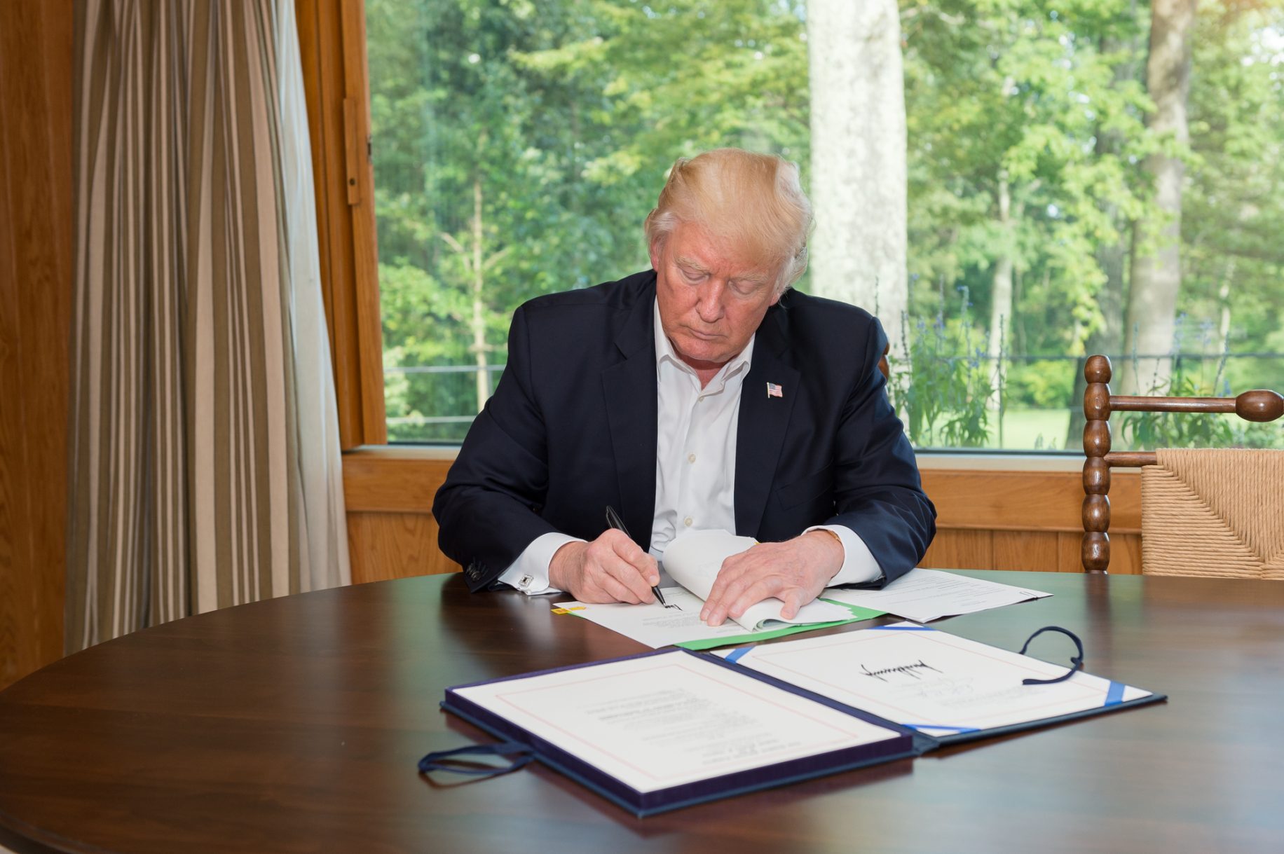 Trump signs executive order that sanctions anyone who interferes with