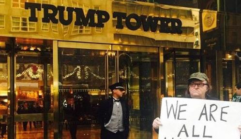 Michael Moore Stands Next To Trump Tower Holding Truly Bizarre Sign Featured
