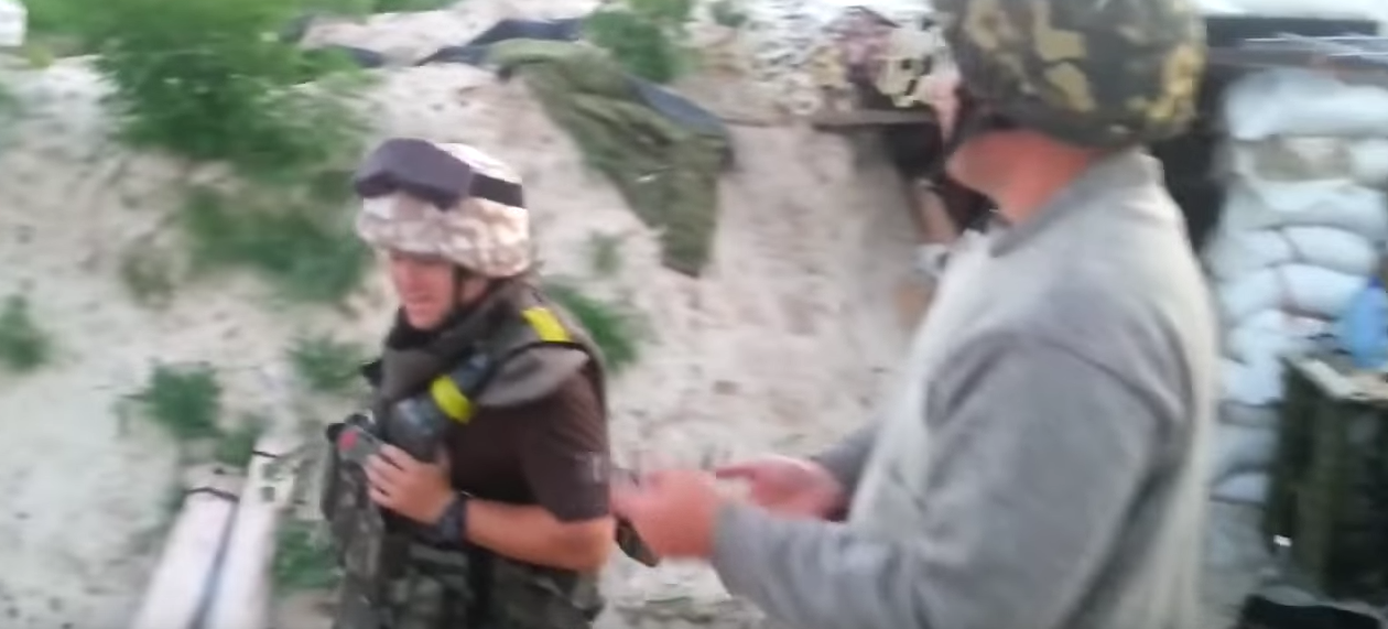 Watch Ukrainian Soldiers Playing With Shrapnel While Being Shelled Featured