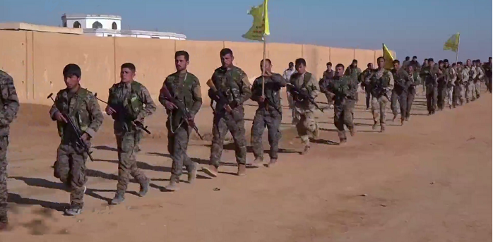 U.S. Backed Syrian Defense Forces Continue Assault On ISIS Capital In Syria Featured