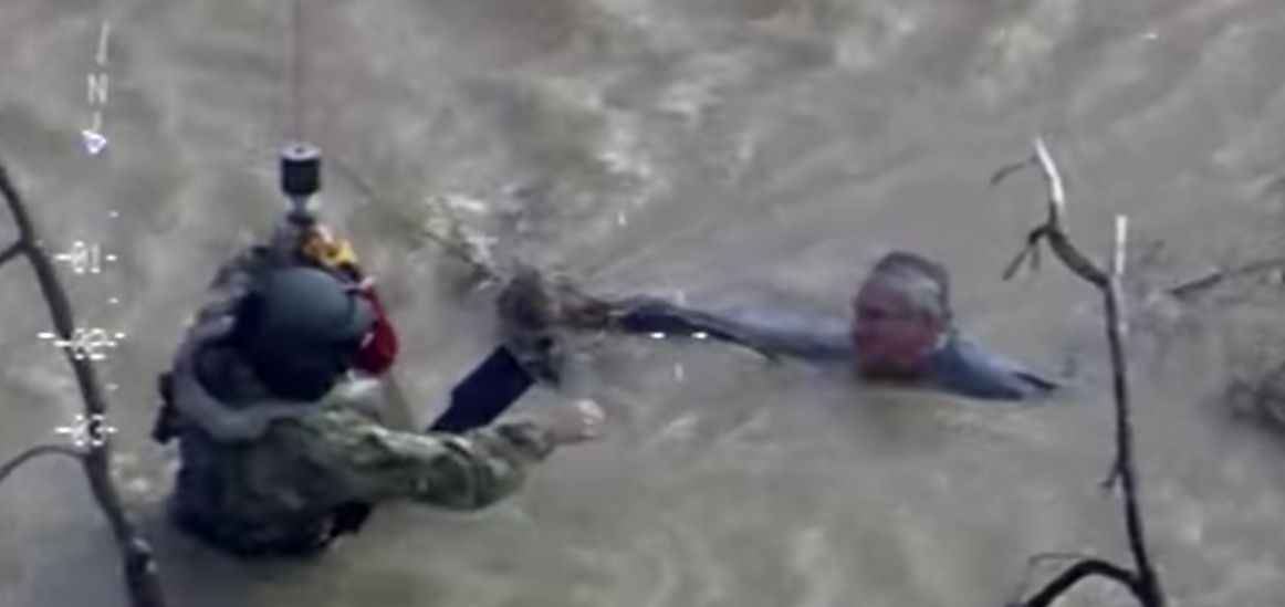 (Watch) CA National Guard Black Hawk Crew Rescues Man From Rushing Water During Flood Featured