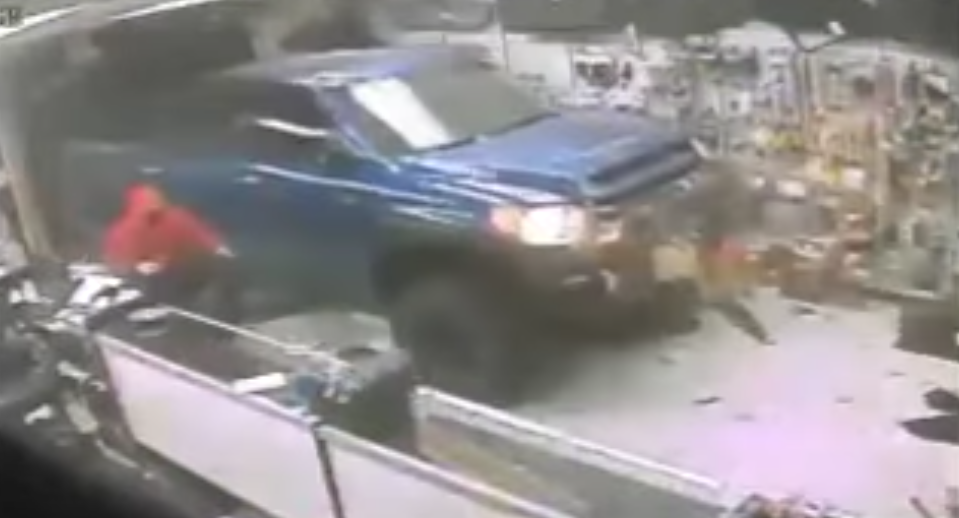 (VIDEO) Robbers Drive Truck Through Gun Store Window & Take Off With Firearms Featured