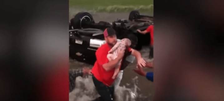 Amazing Video: Strangers Rescue Infants Trapped In Submerged Overturned SUV During Tornado Featured