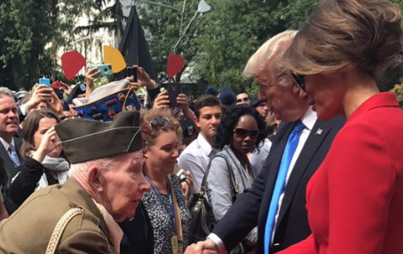 Trump enters crowd to shake hands of American WWII vets during speech in France Featured