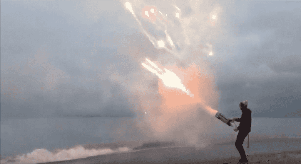 Watch a roman candle minigun fireworks show with 1,000s round in less