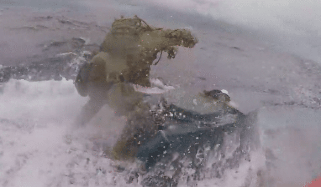 VIDEO: Coast Guardsman jumps onto moving drug-smuggling submarine and bangs on hatch