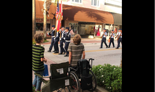 Wheelchair-Bound Teen Stands For American Flag Featured