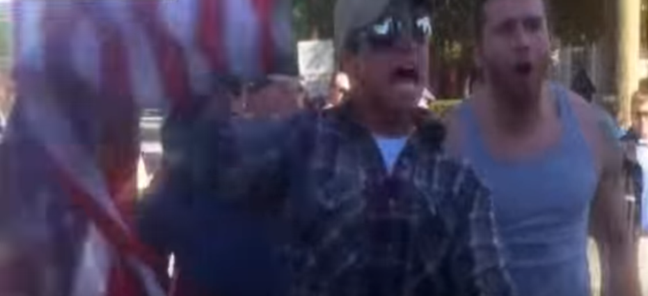 Watch Two Veterans Take Down A Funeral Protester & Rescue The Flag Featured