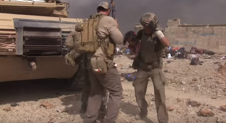 Must Watch: Former Green Beret-turned-aid worker runs through ISIS gunfire to rescue little girl Featured