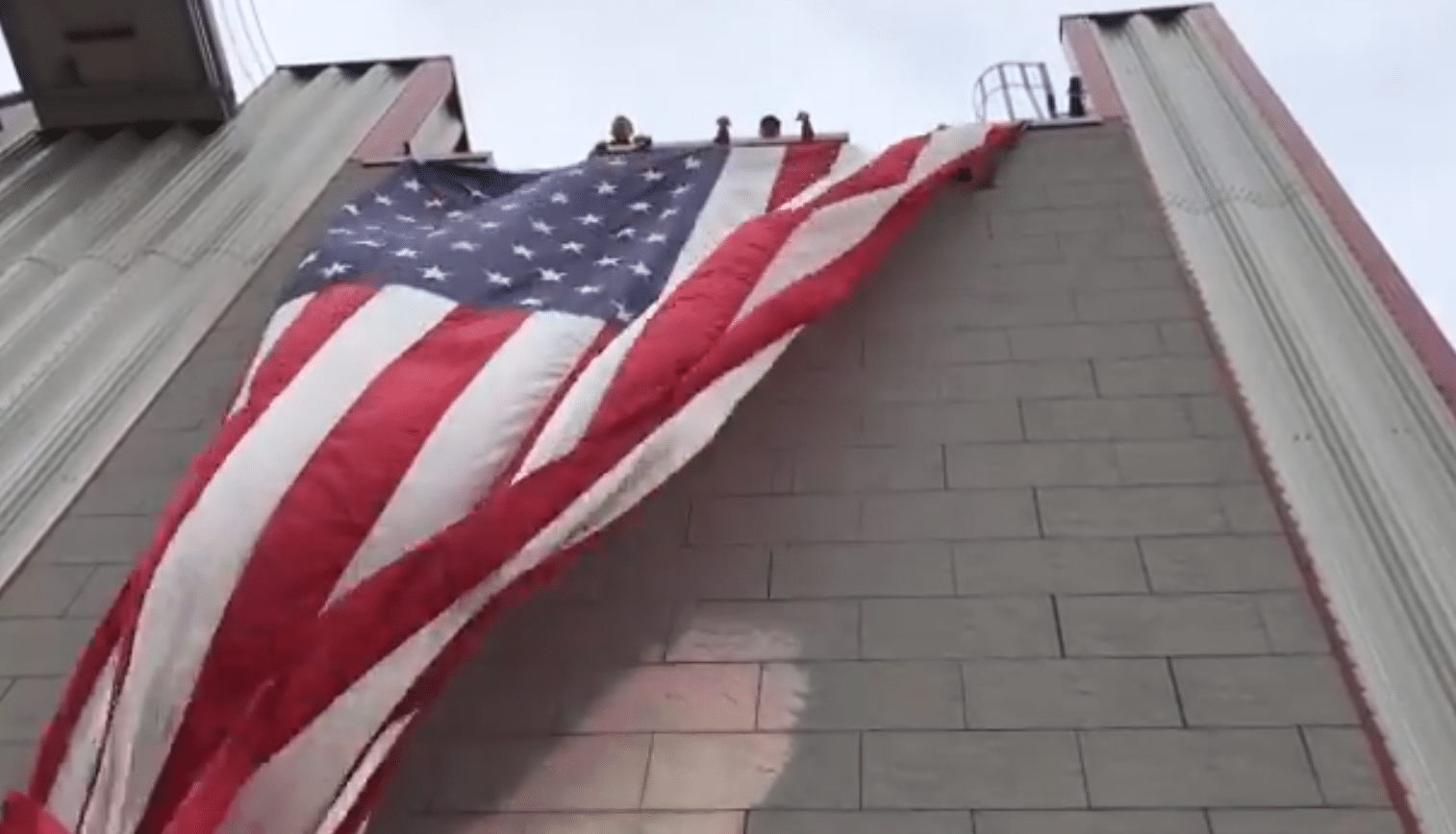Woman arrested after burning US flag in 9/11 memorial on VA overpass ...