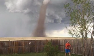 Photo Gone Viral: Canadian Man Mows Lawn With Tornado In Background Featured
